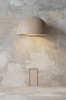 Quiet Passage – a minimalist door beneath a warm designer lamp