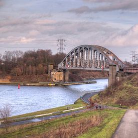 Abandoned bridge over the water by P van Beek