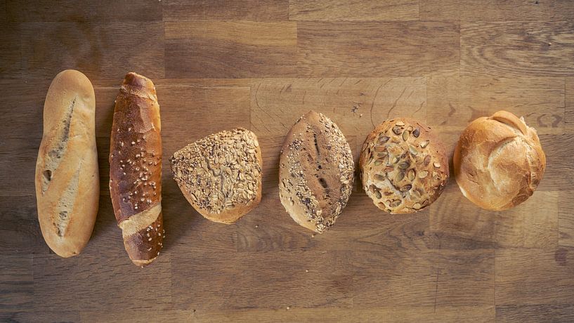 Flat lay of selection of a variety of different buns, rolls and  by Robert Ruidl