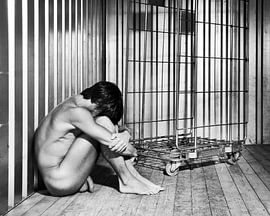 Naked man photographed in a dirty storage container. #A9168