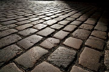 Cobblestones of an old road by Heiko Kueverling