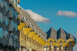 Cube houses in Rotterdam Netherlands against a blue sky with clouds