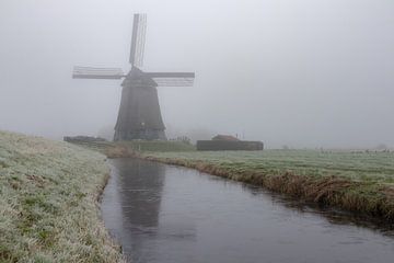 Obdam mill in North Holland in the fog by Bram Lubbers