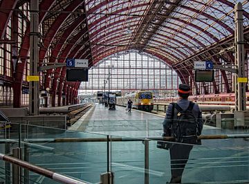 A conductor waiting for his train. by Don Fonzarelli