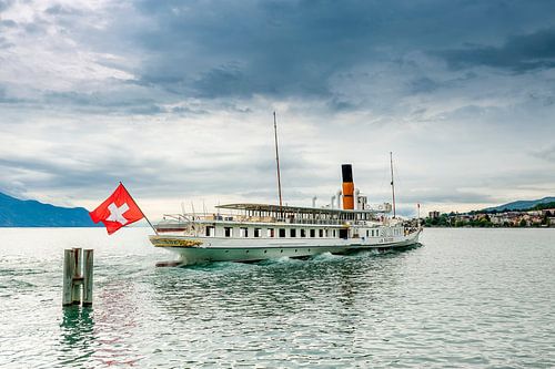 The steam ship La Suisse set sails from Montreux port (Switzerland), by the Leman lake.