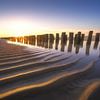 Bright sunset on the beach of Zeeland by Thom Brouwer