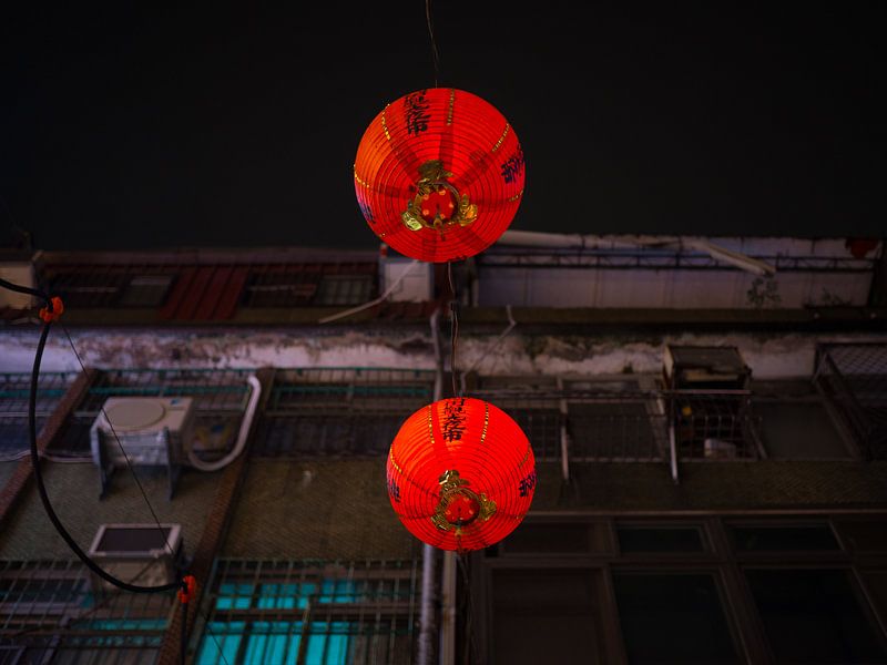 Red Chinese lanterns in the streets of Taipei by Teun Janssen