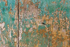 Part of a turquoise-painted wooden door in the village of Labeaume in France by Cindy Mulder