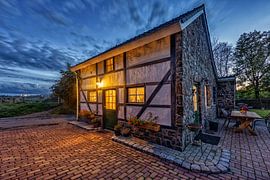 Evening photo of a half-timbered house in southern Limburg by John Kreukniet