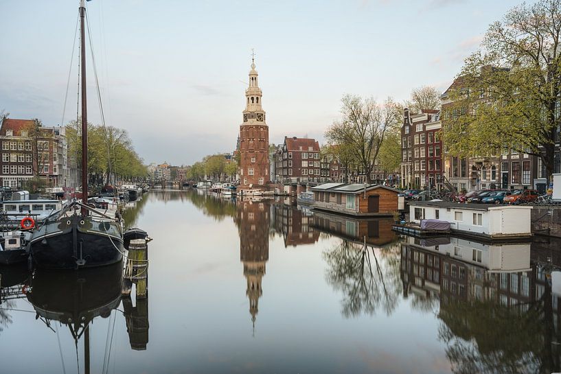 Montelbaan tower, canal and old houses in Amsterdam, Netherlands. by Lorena Cirstea