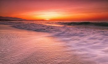 Zonsondergang bij zee