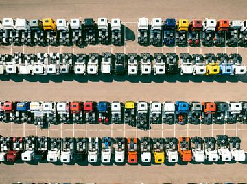 Trucks in a row at a parking lot seen from above by Sjoerd van der Wal