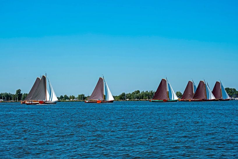 Traditional skutsjessilen on the Sneekermeer in Friesland Netherlands by Eye on You