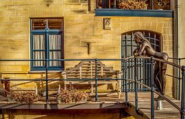 Bronzen beeld in Valkenburg sur John Kreukniet