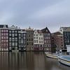 Amsterdamer Grachtengebäude am Damrak von Patrick Verhoef