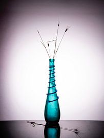blue-green vase with a snake motif and  withered blades of grass. by Gerhard de Wit
