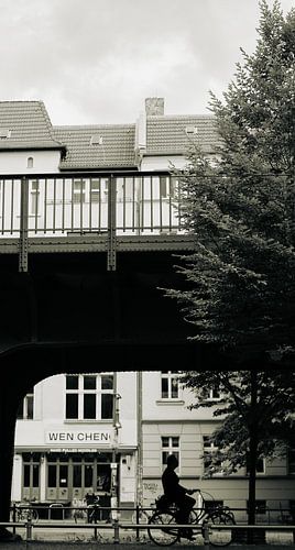 Berlin Monochrome – Cyclist Under the Elevated Rail