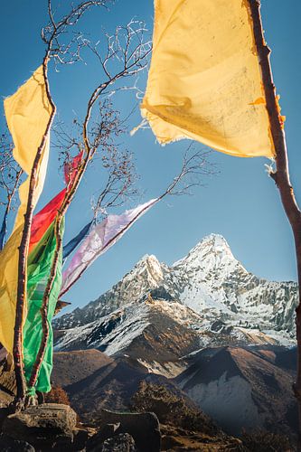 Tibetan flags in the Himalayas overlooking Mount Ama Dablam by Thea.Photo