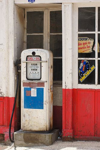 Old abandoned garage with petrol pump