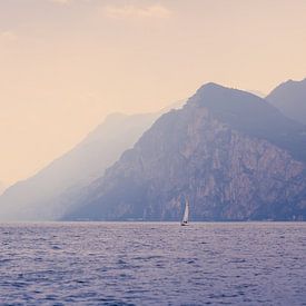 Lonely sailboat in front of approaching rain front on Lake Garda, Italy by Raphael Koch