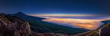 Tenerife with shining clouds and stars in Teide National Park.