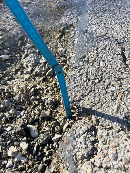 Pothole on a German road by de-nue-pic