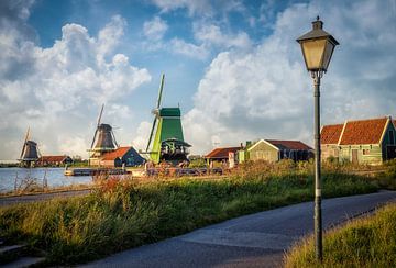 Windmills and lamppost with clouds on the Zaans schans in Zaandam. by Bart Ros