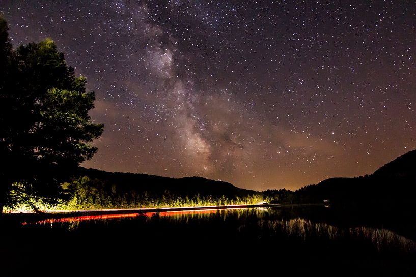 Passing car along Clark's Pond by Steven Valkenberg