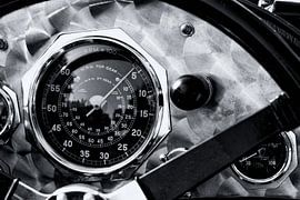 Brushed aluminium dashboard with speedometer on a vintage 1920s British race car