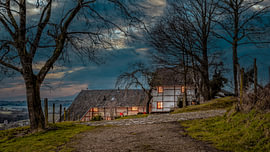 An evening photograph of a half-timbered cottage in South Limburg