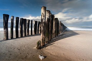 Breakwaters on the beach by Niek Goossen