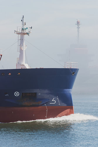 A seagoing vessel leaves the locks at IJmuiden