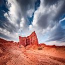 Red rock formations under an angry cloud cover by Chris Stenger thumbnail