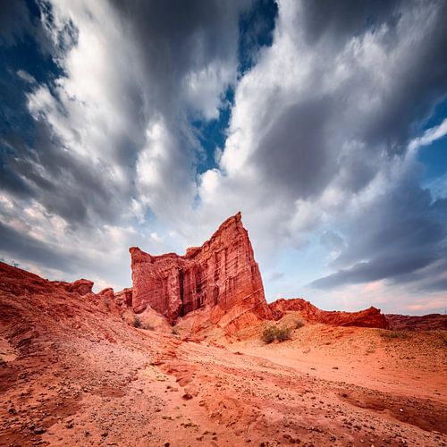 Red rock formations under an angry cloud cover