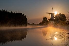 Windmill the Butterfly at sunrise and fog by Alex van den Akker
