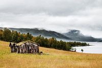 Abandoned barn near mountain lake