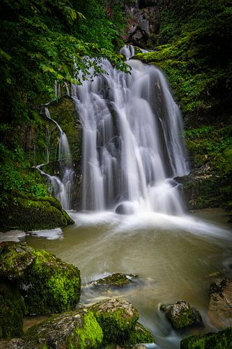 A hidden waterfall between the mountains in France