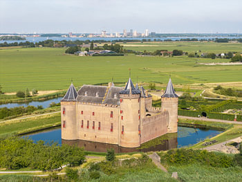 Muiderslot Castle, nestled between water and meadows
