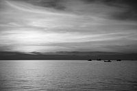 Seaview with sunset and boats.
