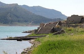Old olive mill in Andalusia surfacing in a reservoir. by Jan Katuin
