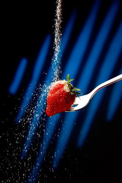 Strawberry on fork with sugar by Gerhard de Wit