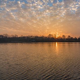 Sunrise with sheep clouds above lake by Mike Maes