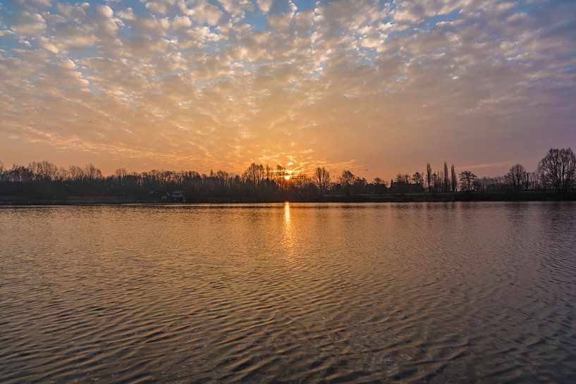 Sunrise with sheep clouds above lake by Mike Maes