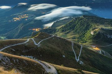 Road to Monte Baldo and Monte Altissimo at Lake Garda with fog. In the morning at sunrise