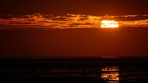 Zonsopkomst boven het wad bij Texel