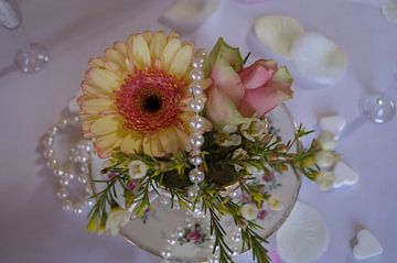 Flower arrangement in a tea cup