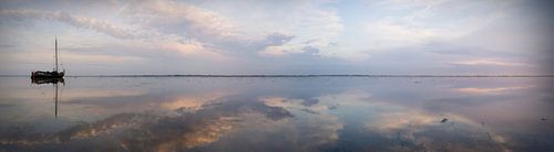 Dryland flatboat in vast tidal landscape