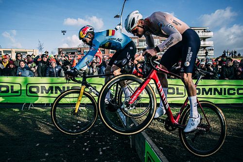 Mathieu van der Poel jumping with Wout Van Aert.