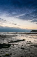 Sunset over a low tide beach