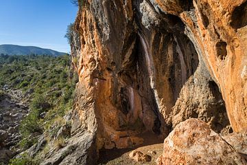 Coves Roges 5, red-brown rocks and caves by Adriana Mueller